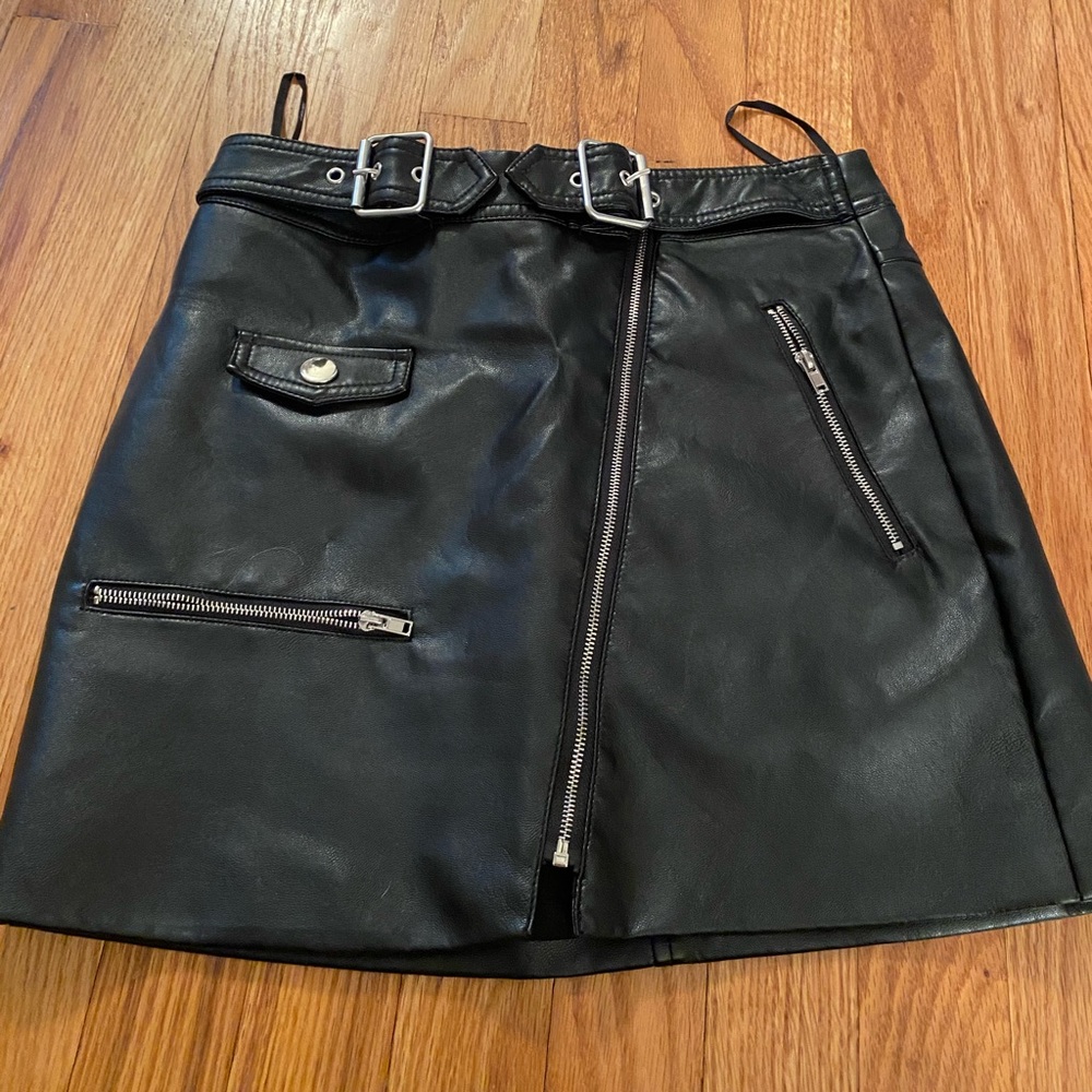 Black leather skirt with buckle that’s adjustable